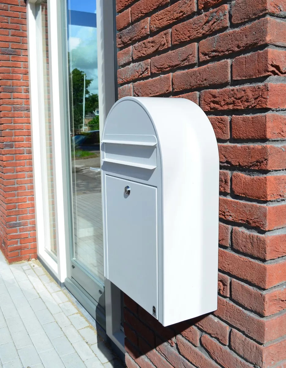 brick wall mounted, outside of an office, white bobi slim mailbox