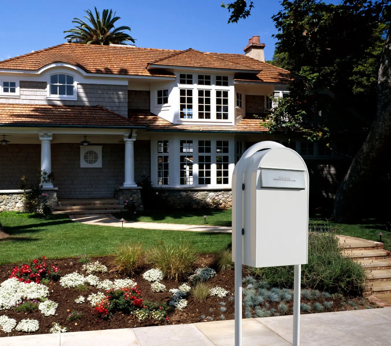 bobi grande b white mailbox and post edited in front of a house